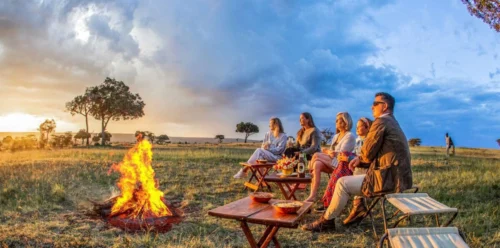 African sundowner at Karen Blixen luxury Camp in Mara North Conservancy, Masai Mara National Reserve. Adeli Kenya Safaris is the best safari tour company & travel agency in Kenya. We offer luxury Africa Kenya safari tour packages & holidays & Tanzania safaris
