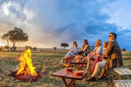 African sundowner at Karen Blixen luxury Camp in Mara North Conservancy, Masai Mara National Reserve. Adeli Kenya Safaris is the best safari tour company & travel agency in Kenya. We offer luxury Africa Kenya safari tour packages & holidays & Tanzania safaris