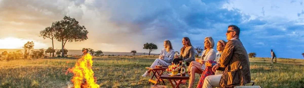 African sundowner at Karen Blixen luxury Camp in Mara North Conservancy, Masai Mara National Reserve. Adeli Kenya Safaris is the best safari tour company & travel agency in Kenya. We offer luxury Africa Kenya safari tour packages & holidays & Tanzania safaris