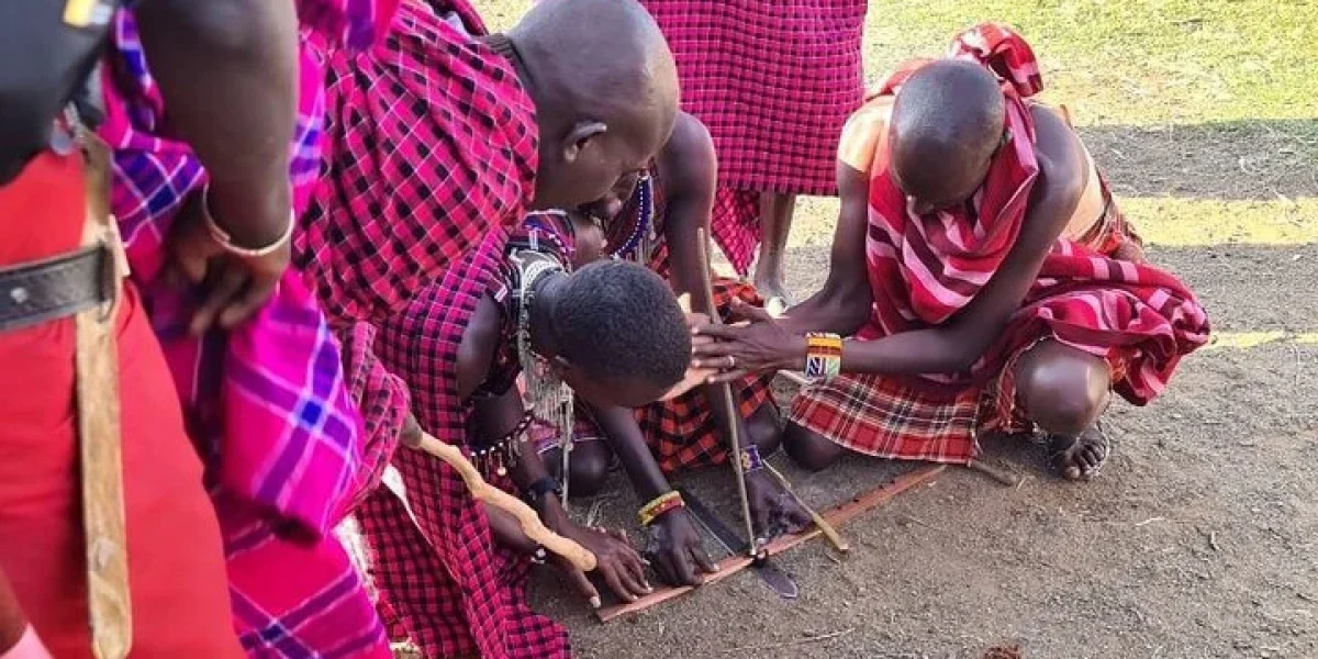 Maasai warriors at Masai Mara National Reserve Kenya - Book Luxury Africa Wildlife and wildebeest migration safaris in Kenya and Tanzania with Adeli Kenya Safaris - best Africa safari tour operator & travel agency in Kenya